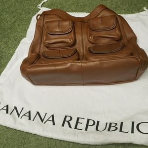 Large leather purse never carried. Cleaning closet